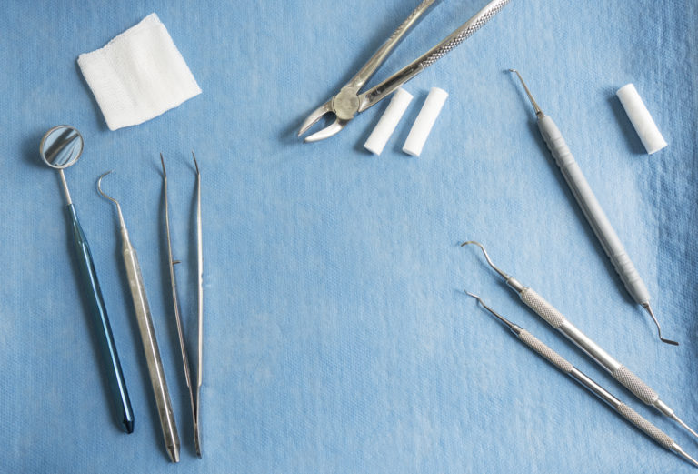 High Angle View Of Dental Equipment On Tray In Clinic